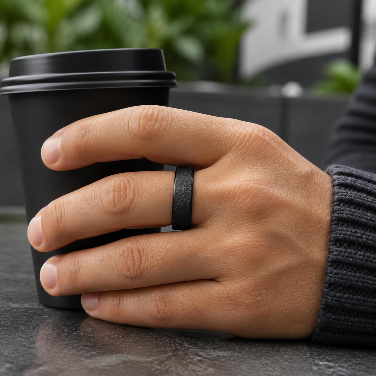 Man wearing the Wrongduck V3 matte black smart ring while holding a coffee cup#color_v3-matte-black