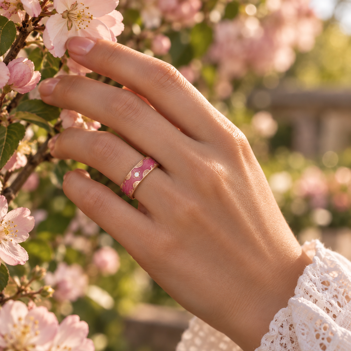 Woman wearing a retro red smart ring beside blooming flowers in warm natural light