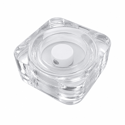 Closed clear square smart ring charging case with white circular cradle and center charging post