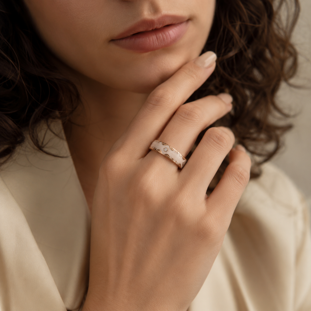 Close-up of a Retro White Smart Ring worn on a woman's finger near her face