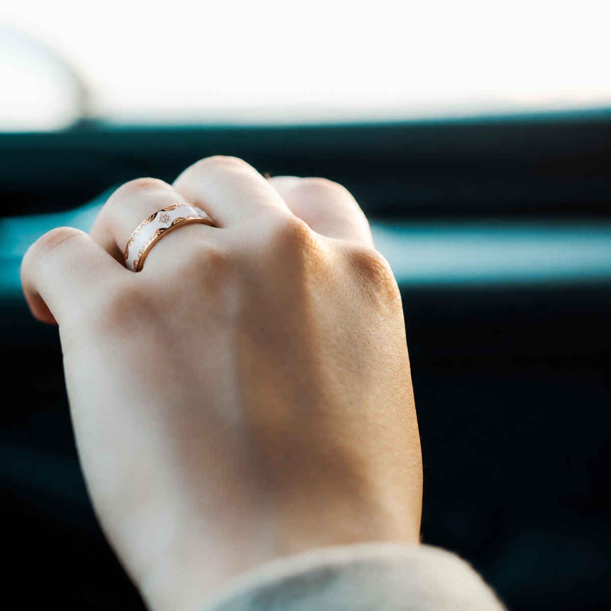 Retro White Smart Ring with gold accents worn on a woman's hand in natural light