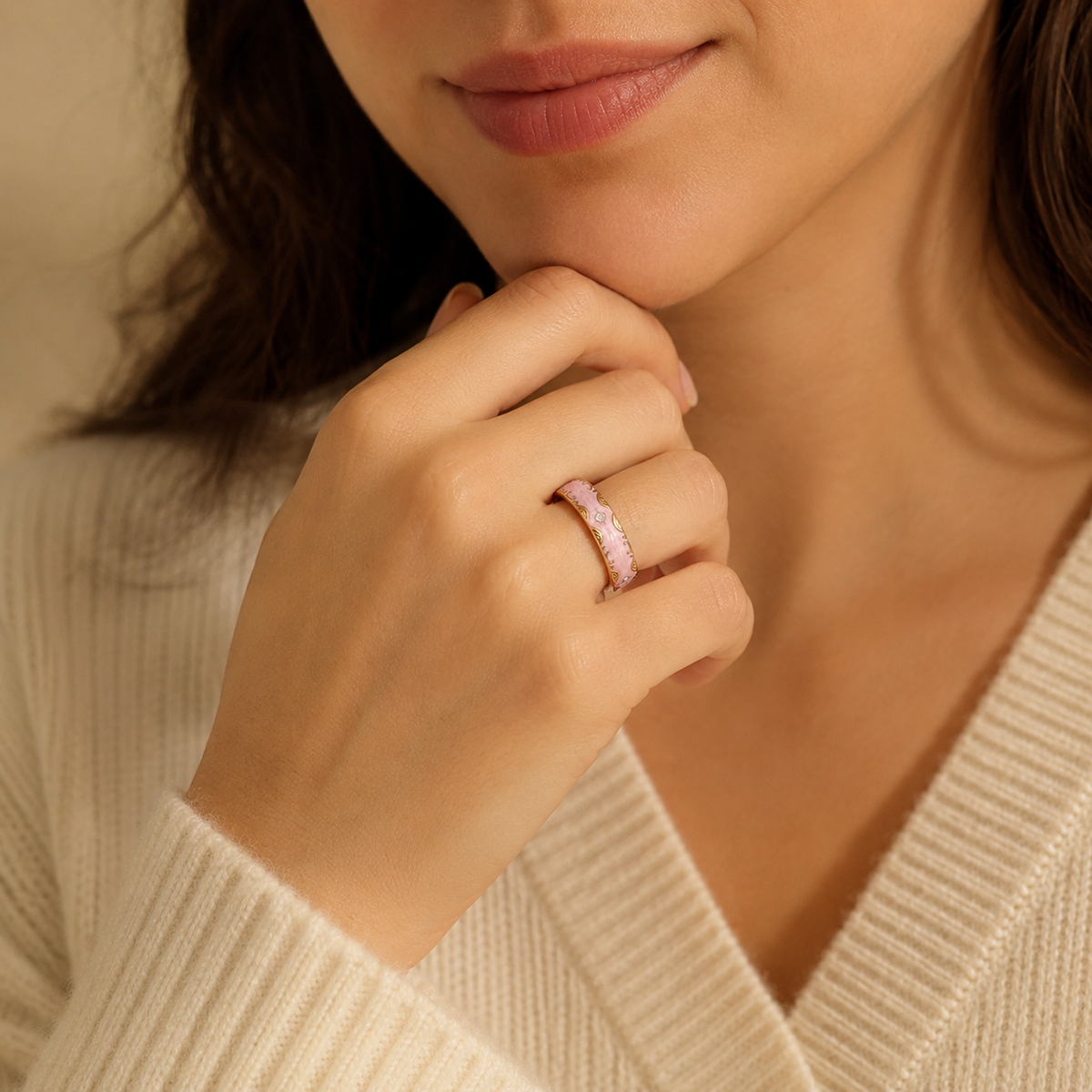 Woman wearing a RetroPink Smart Ring with gold detailing in a warm close-up portrait