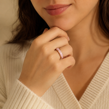 Woman wearing a RetroPink Smart Ring with gold detailing in a warm close-up portrait