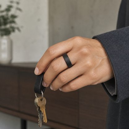Model wearing black textured V3 matte smart ring while holding keys#color_v3-matte-black