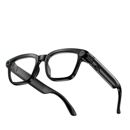 Angled rear view of black AI smart glasses showing camera, charging contacts, and side port