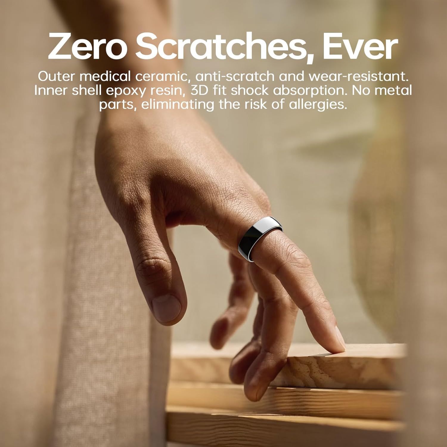 Hand wearing black and white ceramic smart ring under scratch-resistant material details