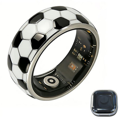 Football-pattern smart ring with black inner sensors and a dark square charging case on white