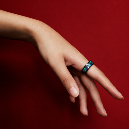 Wrongduck Nebula smart ring worn against a deep red fashion background#color_nebula