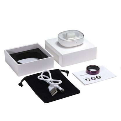 Purple smart ring package with charging dock, USB cable, pouch, manual, and white box