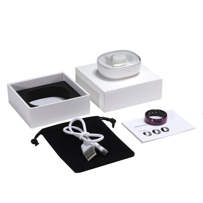 Purple smart ring package with charging dock, USB cable, pouch, manual, and white box
