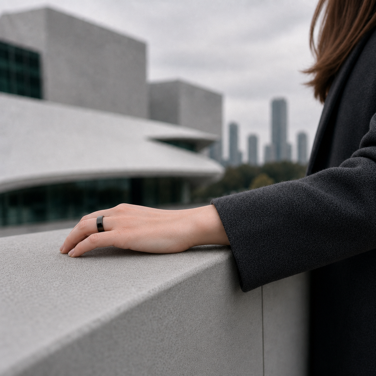 Woman wearing a glossy black SR1 smart ring at a city overlook#color_sr1-black