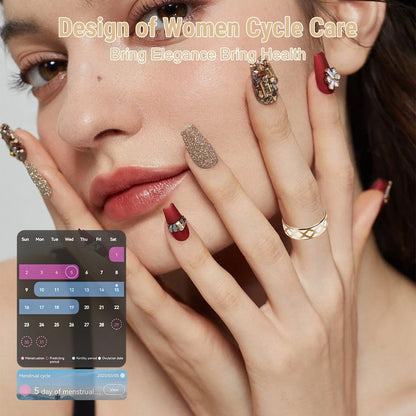 Woman wearing a gold floral SR4 ring beside a menstrual cycle tracking calendar